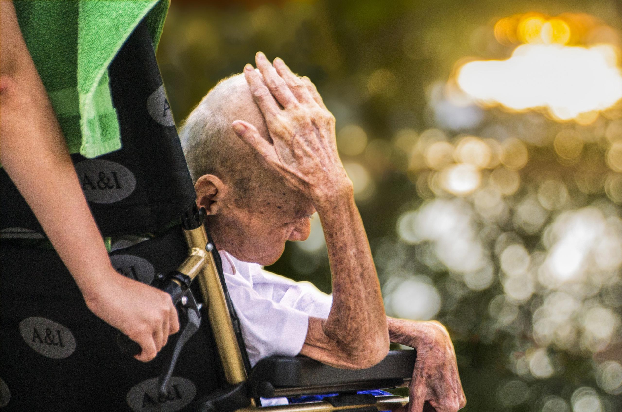 Elderly Gentleman Sitting Helplessly In Wheel Chair