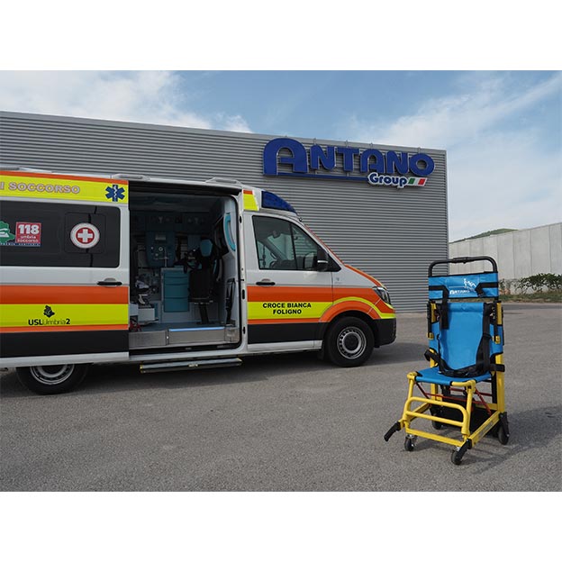 The LG EVACU PLUS EL chair with ambulance in background